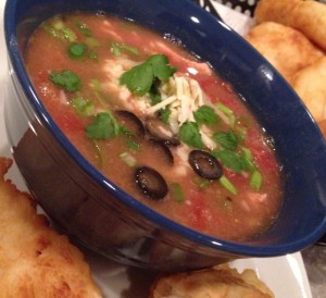 Tortilla Soup topped with Shredded Pepper Jack, Sliced Black Olives and Chopped Green Onions